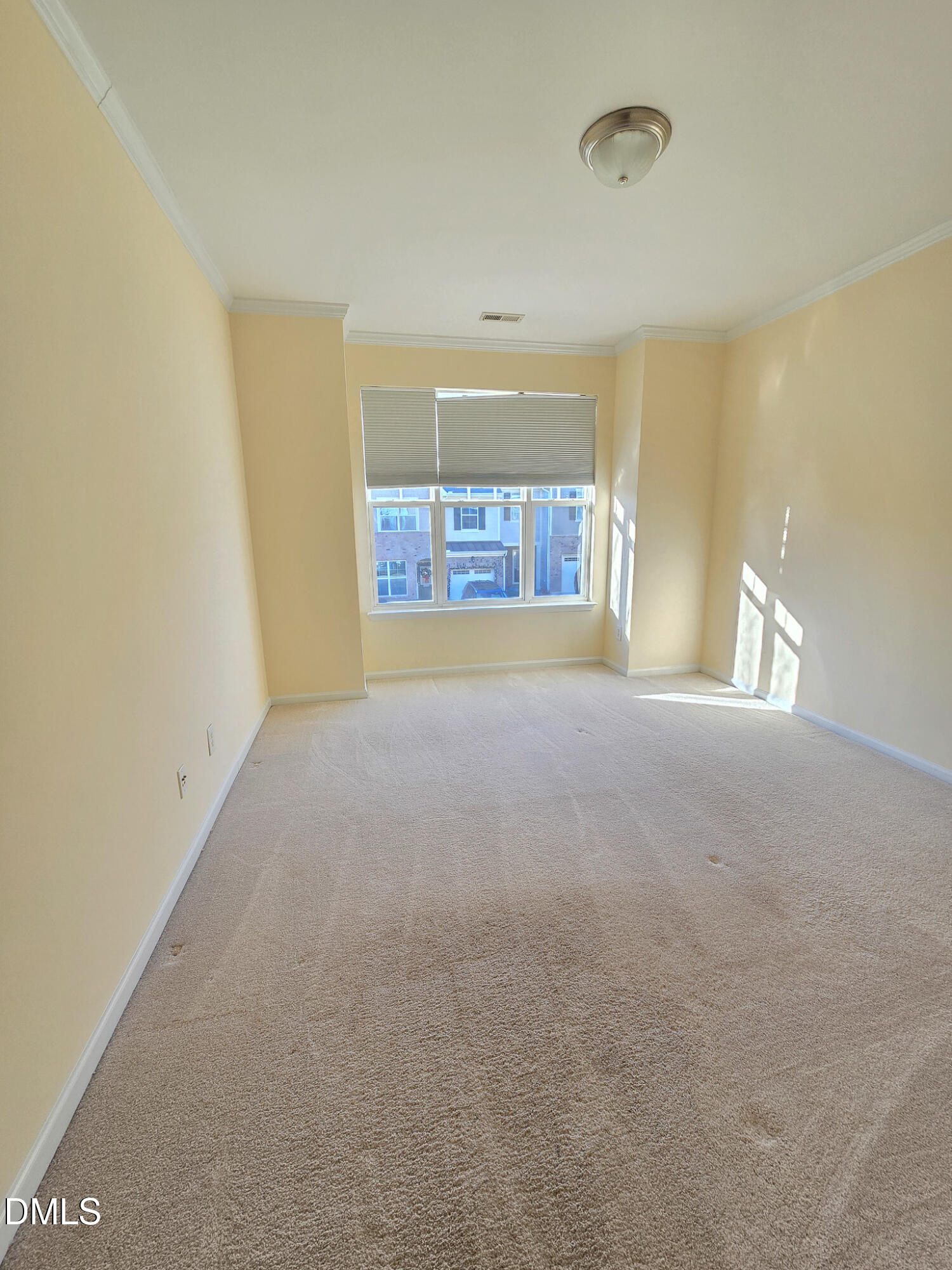 10104 Raven Tree Drive Raleigh, NC 27617 - Photo 26 of 33 a view of an empty room with a window