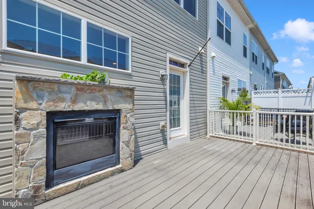 a view of a house with wooden deck