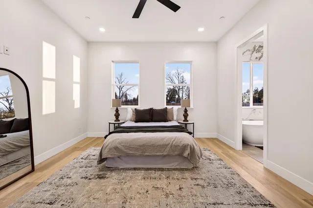a bathroom with a double vanity sink toilet and shower