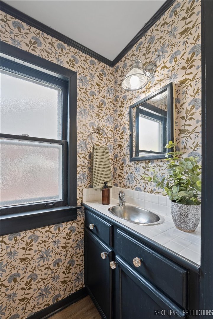 392 Herrick Road Riverside, IL 60546 - Photo 13 of 32 a bathroom with a sink and a mirror