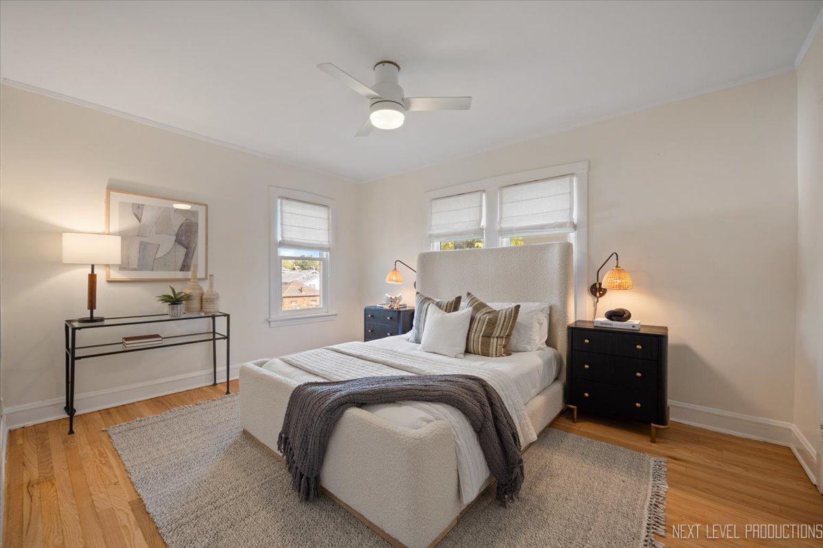 392 Herrick Road Riverside, IL 60546 - Photo 15 of 32 a bedroom with a bed and wooden floor