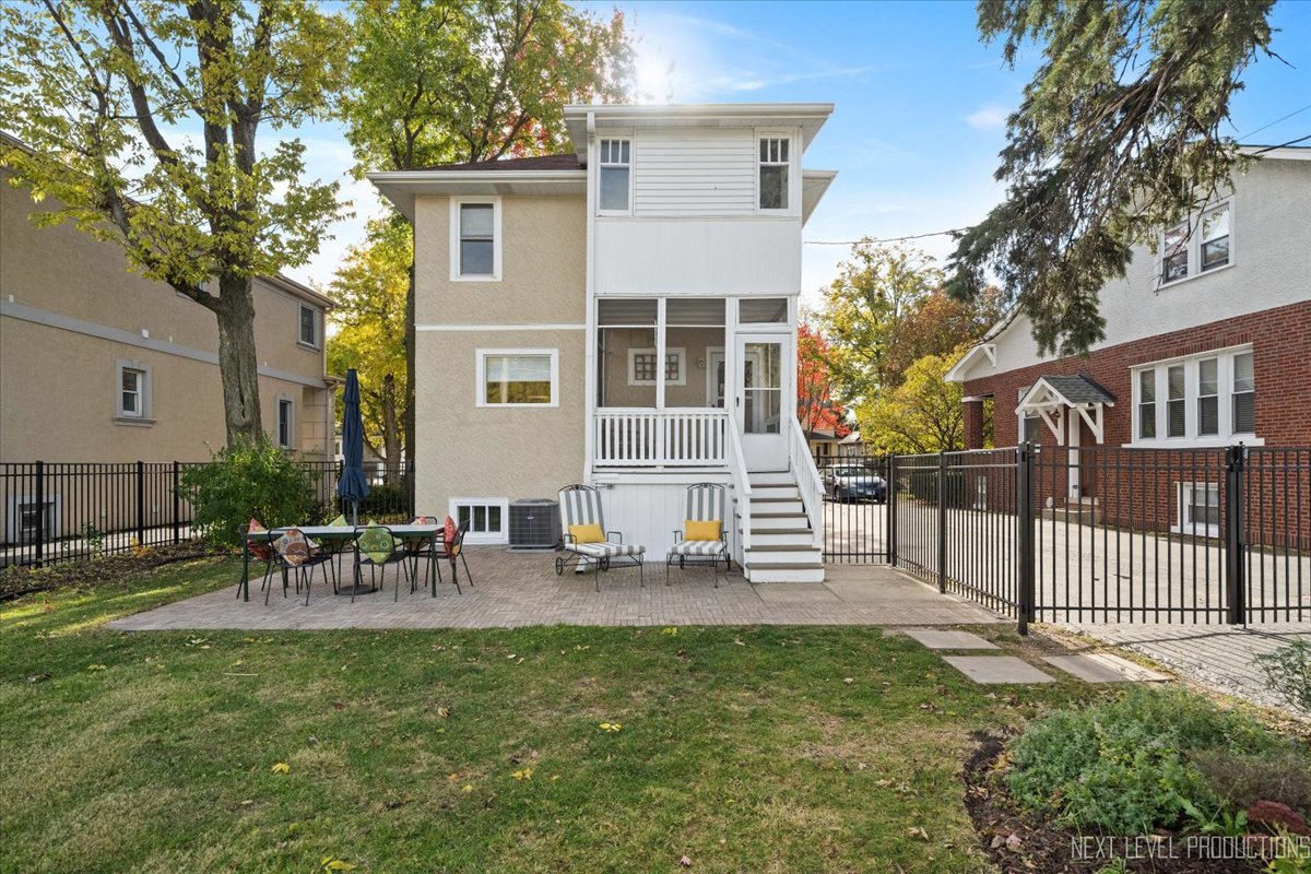 392 Herrick Road Riverside, IL 60546 - Photo 25 of 32 a view of a house with backyard and a tree