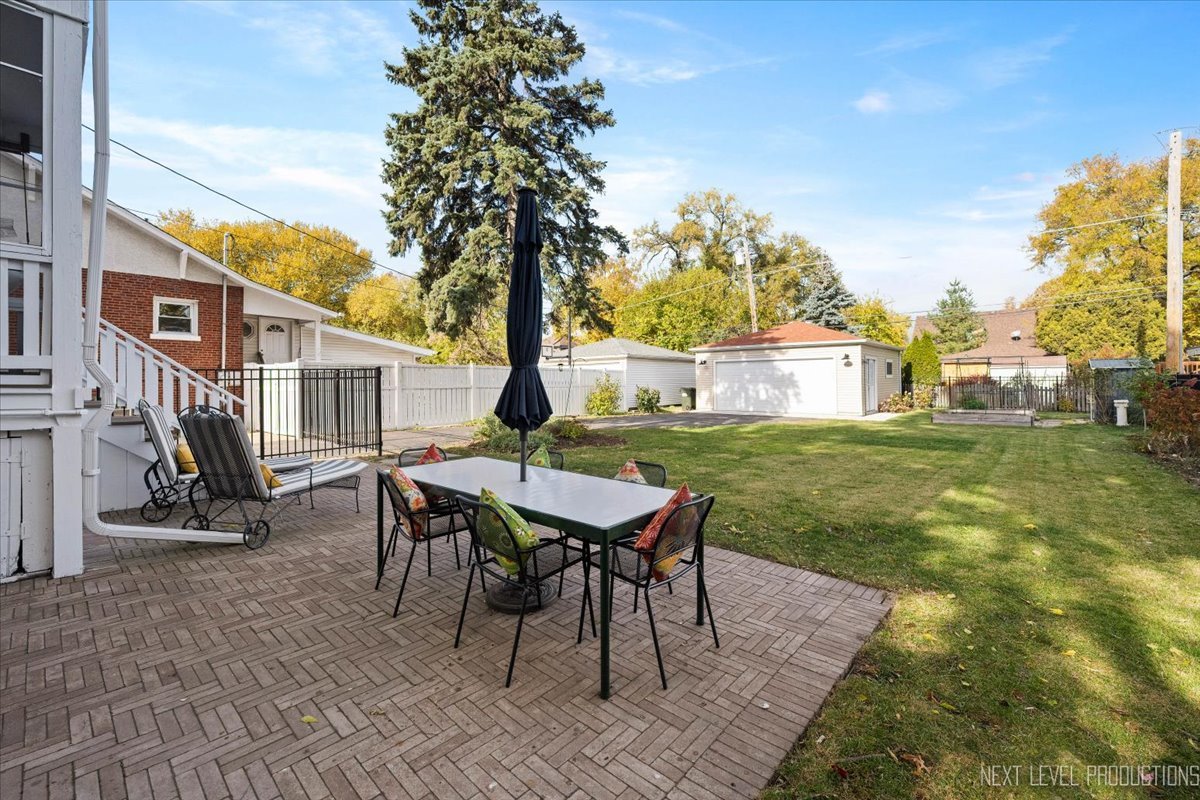 392 Herrick Road Riverside, IL 60546 - Photo 26 of 32 a view of a house with backyard and sitting area
