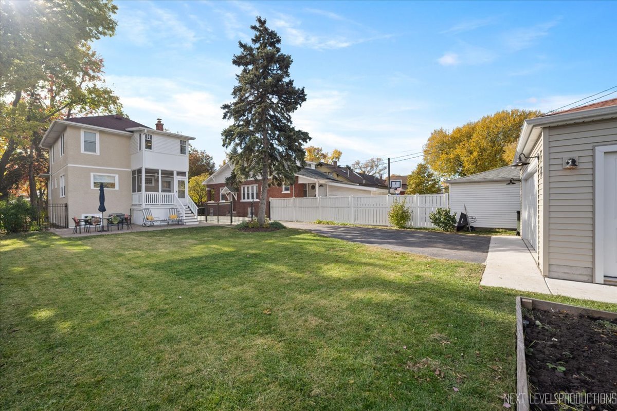 392 Herrick Road Riverside, IL 60546 - Photo 27 of 32 a view of a house with a backyard