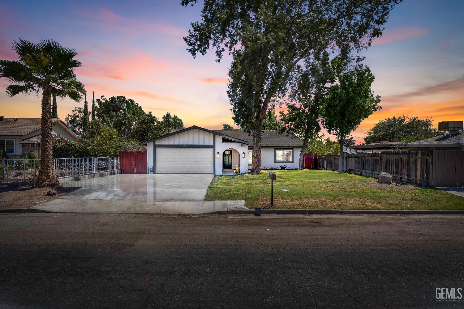 a house that has a tree in front of it