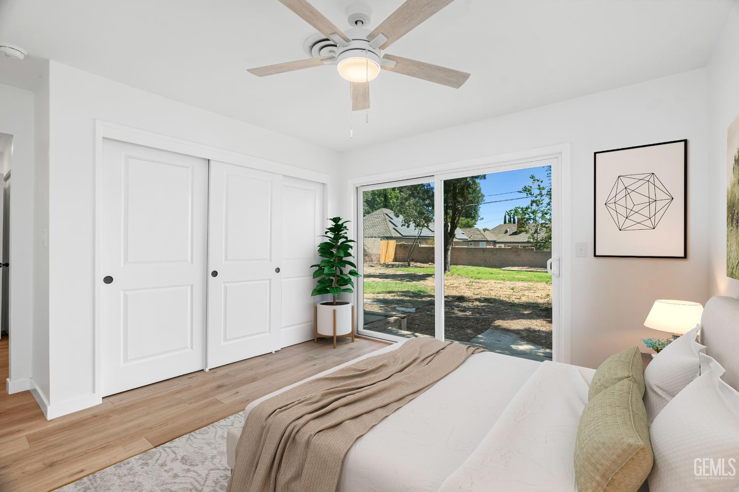 Undisclosed Address Bakersfield, CA 93305 - Photo 11 of 24 a bedroom with a bed and a large window