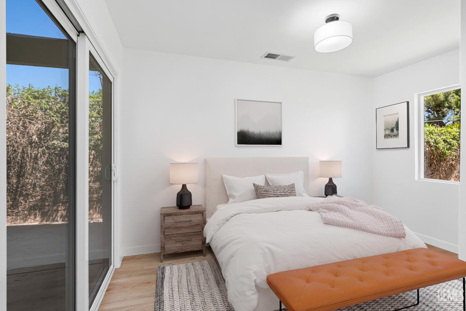 Undisclosed Address Bakersfield, CA 93305 - Photo 16 of 24 a bedroom with a bed and a window