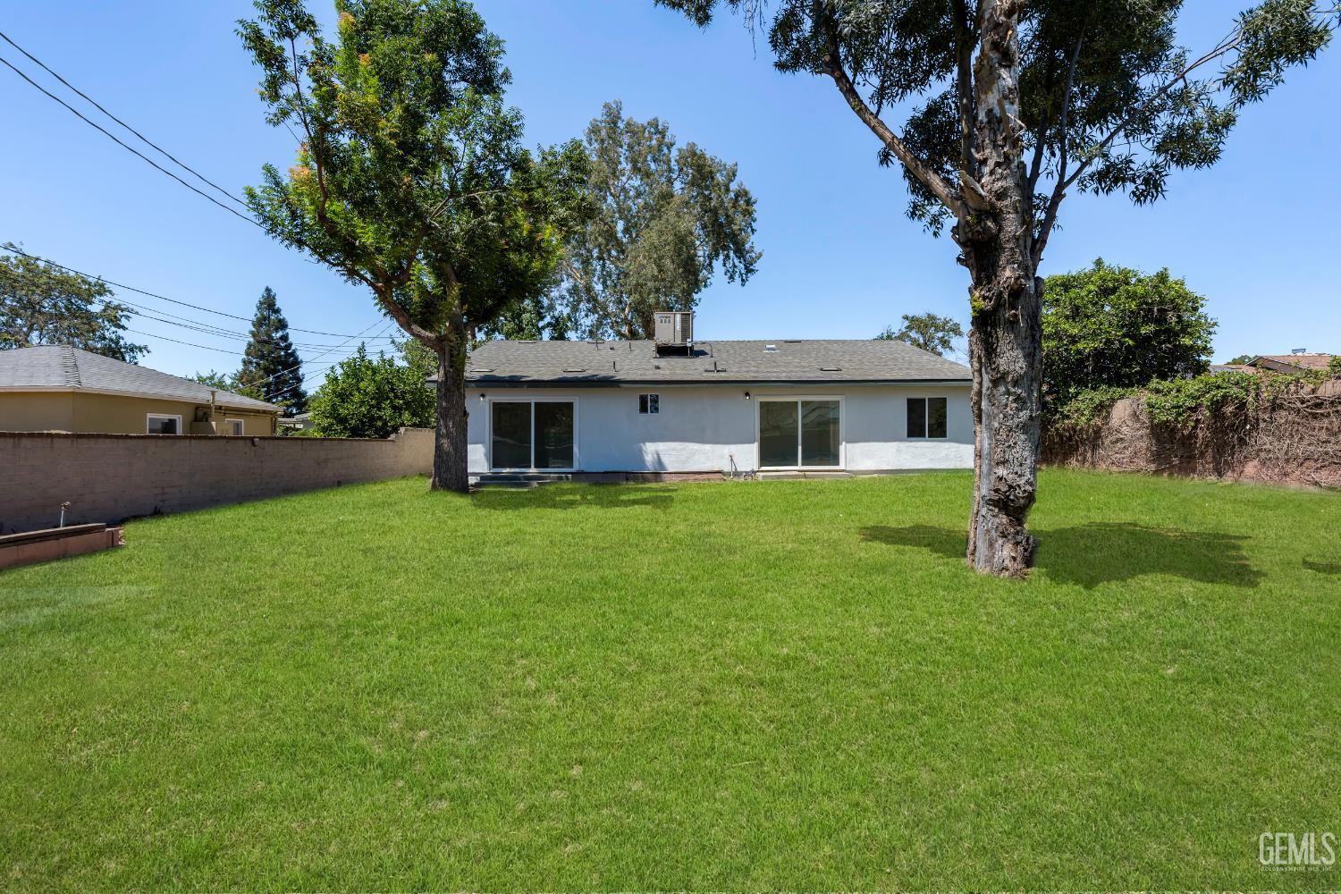 Undisclosed Address Bakersfield, CA 93305 - Photo 20 of 24 a front view of house with yard and green space
