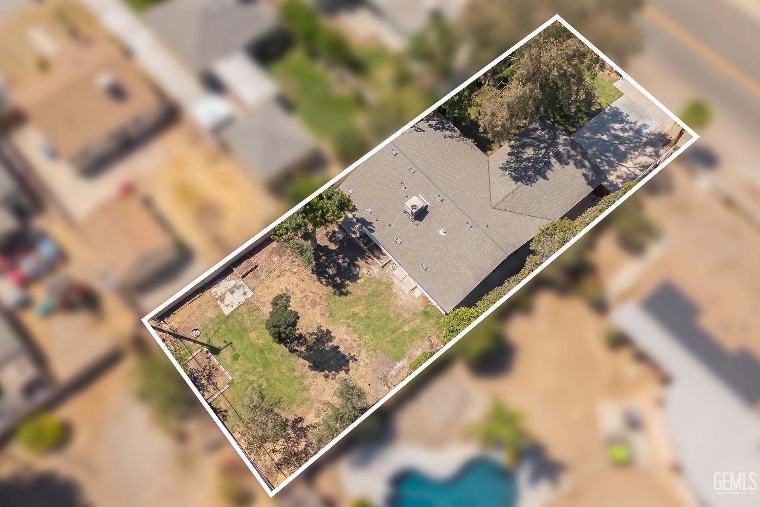 Undisclosed Address Bakersfield, CA 93305 - Photo 24 of 24 a view of swimming pool with a trees in the background