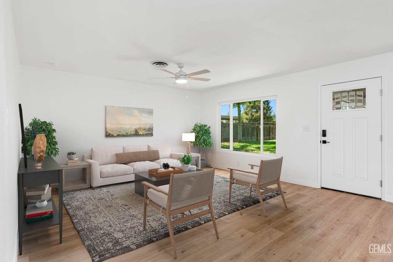Undisclosed Address Bakersfield, CA 93305 - Photo 4 of 24 a living room with furniture and a large window