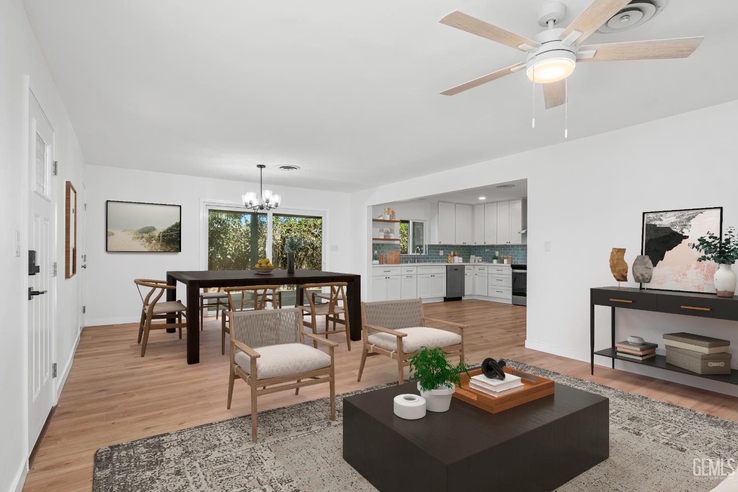 Undisclosed Address Bakersfield, CA 93305 - Photo 5 of 24 a living room with furniture a rug and a chandelier