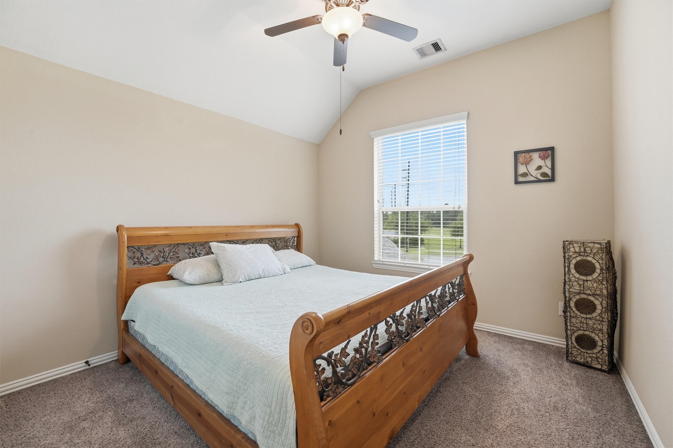12506 Northpointe Ridge Lane Tomball, TX 77377 - Photo 22 of 31 a bed sitting in a bedroom next to a window
