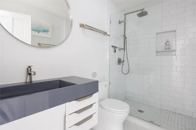 a bedroom with a bed and flat screen tv