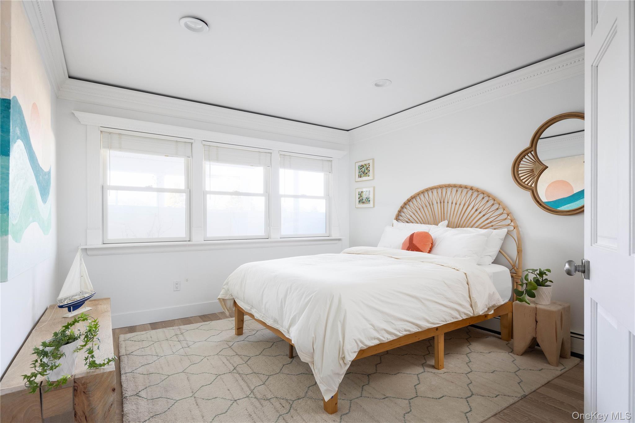 56861 Private Rd B (main) Southold, NY 11971 - Photo 14 of 34 a bedroom with a bed and a window