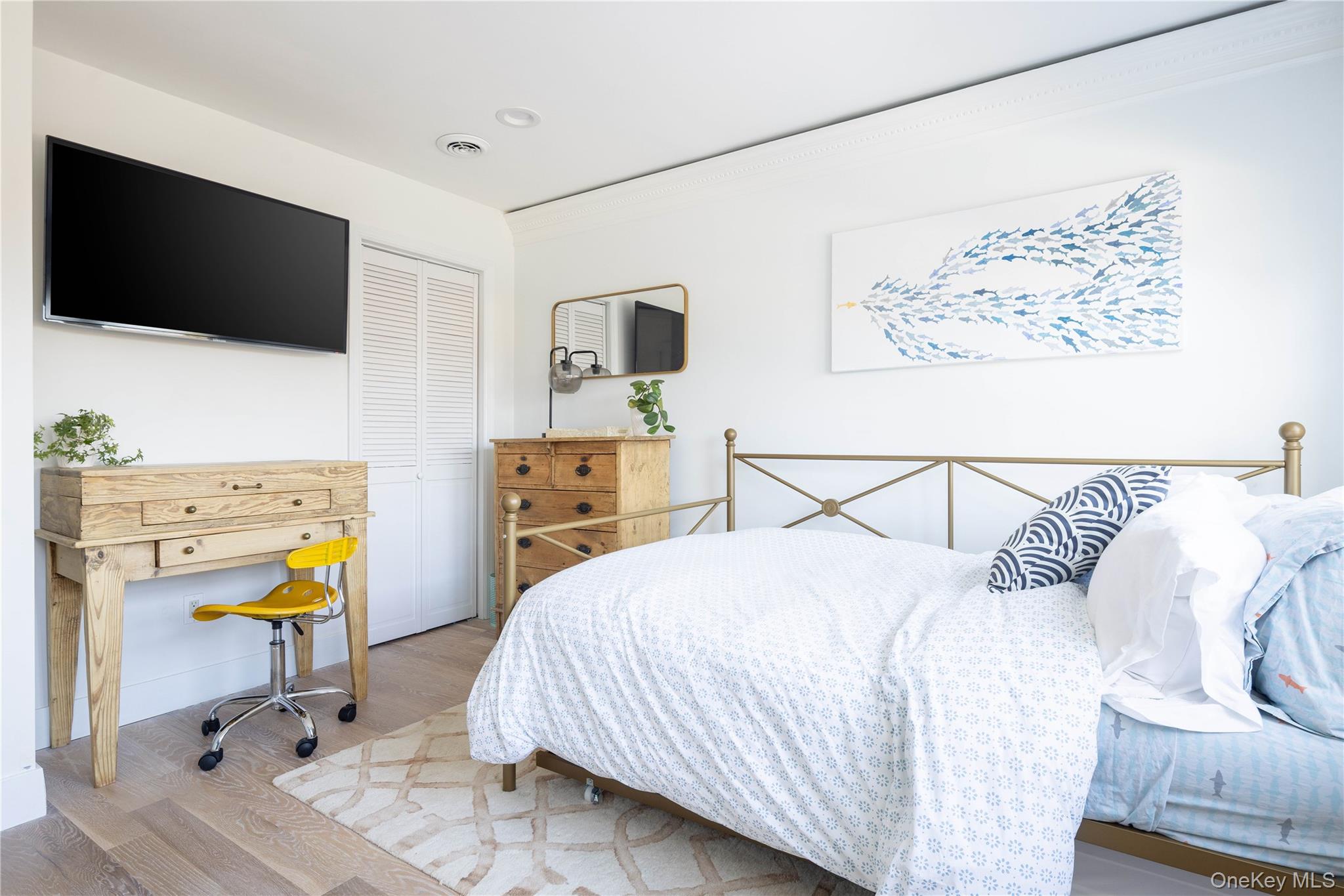 56861 Private Rd B (main) Southold, NY 11971 - Photo 15 of 34 a bedroom with a bed and flat screen tv