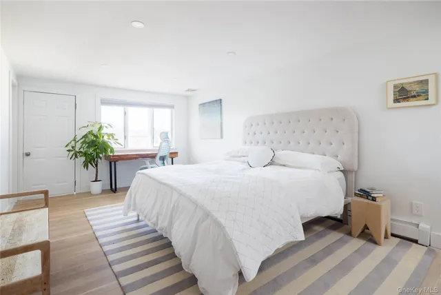 a bed room with a bed and a chair