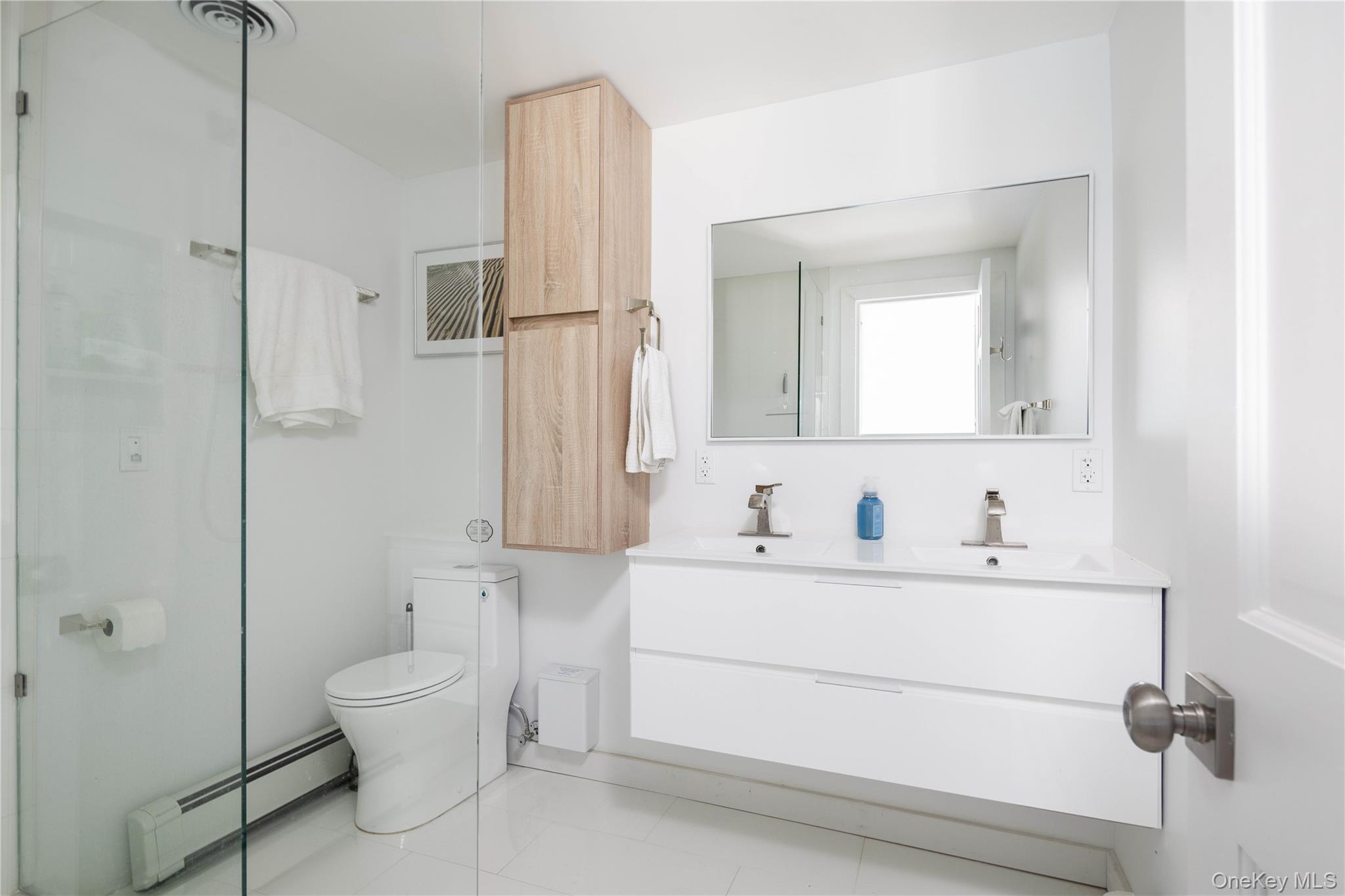 56861 Private Rd B (main) Southold, NY 11971 - Photo 19 of 35 a bathroom with a sink toilet and shower
