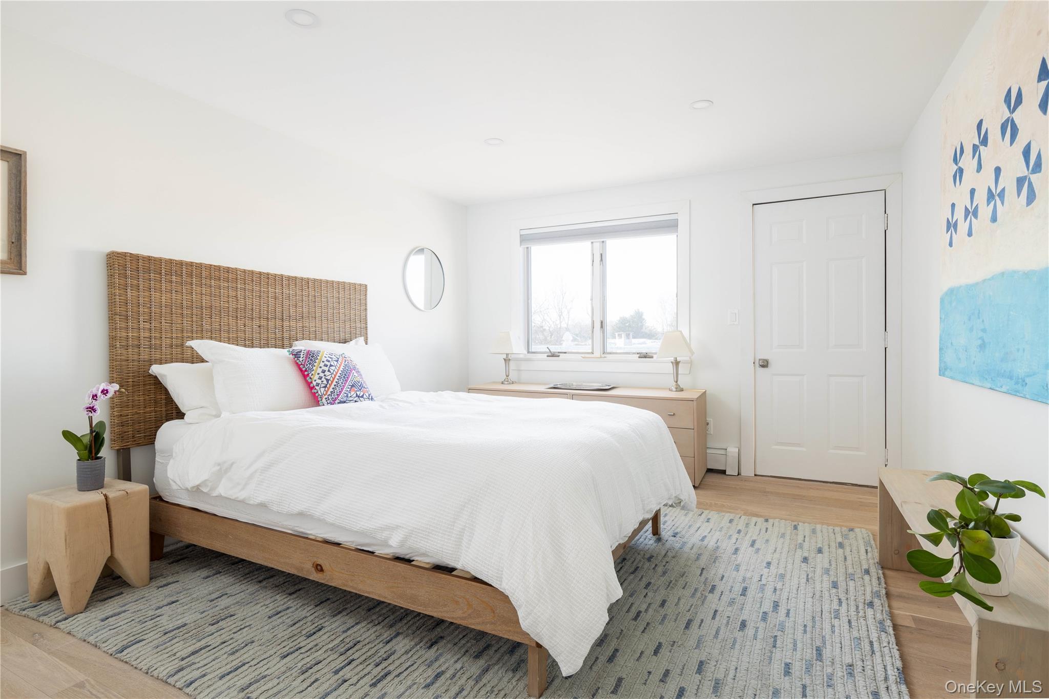 56861 Private Rd B (main) Southold, NY 11971 - Photo 21 of 35 a bedroom with a bed and a window