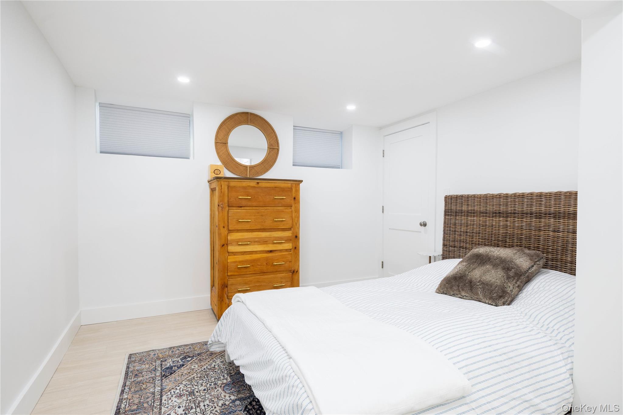 56861 Private Rd B (main) Southold, NY 11971 - Photo 24 of 35 a bedroom with a bed and a dresser
