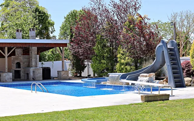 a living room with furniture fireplace and a flat screen tv