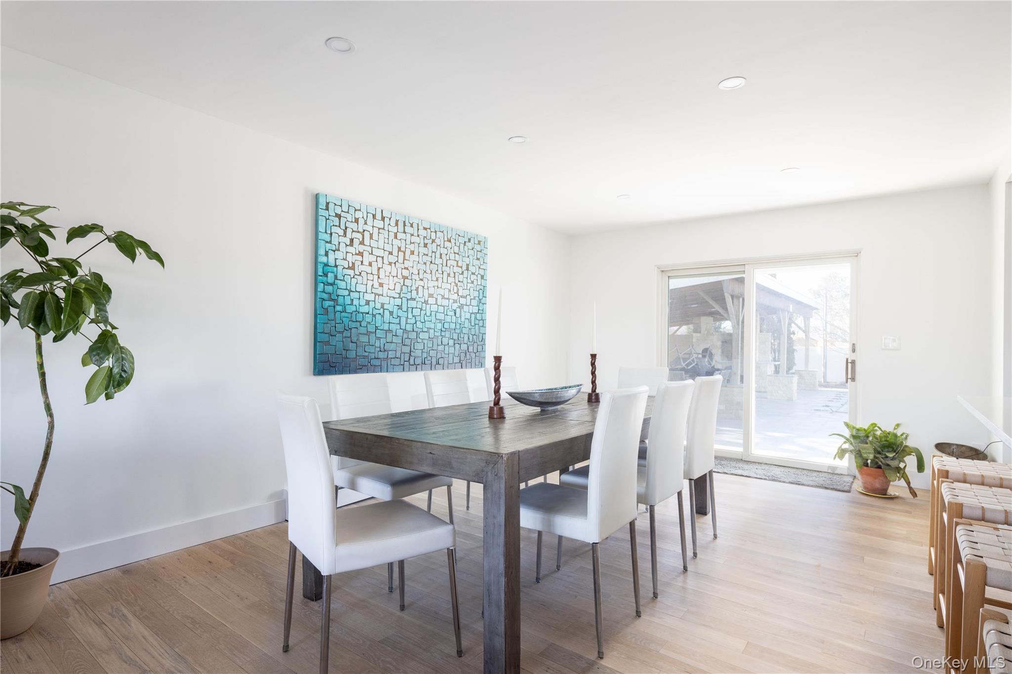 56861 Private Rd B (main) Southold, NY 11971 - Photo 10 of 35 a view of a dining room with furniture window and wooden floor