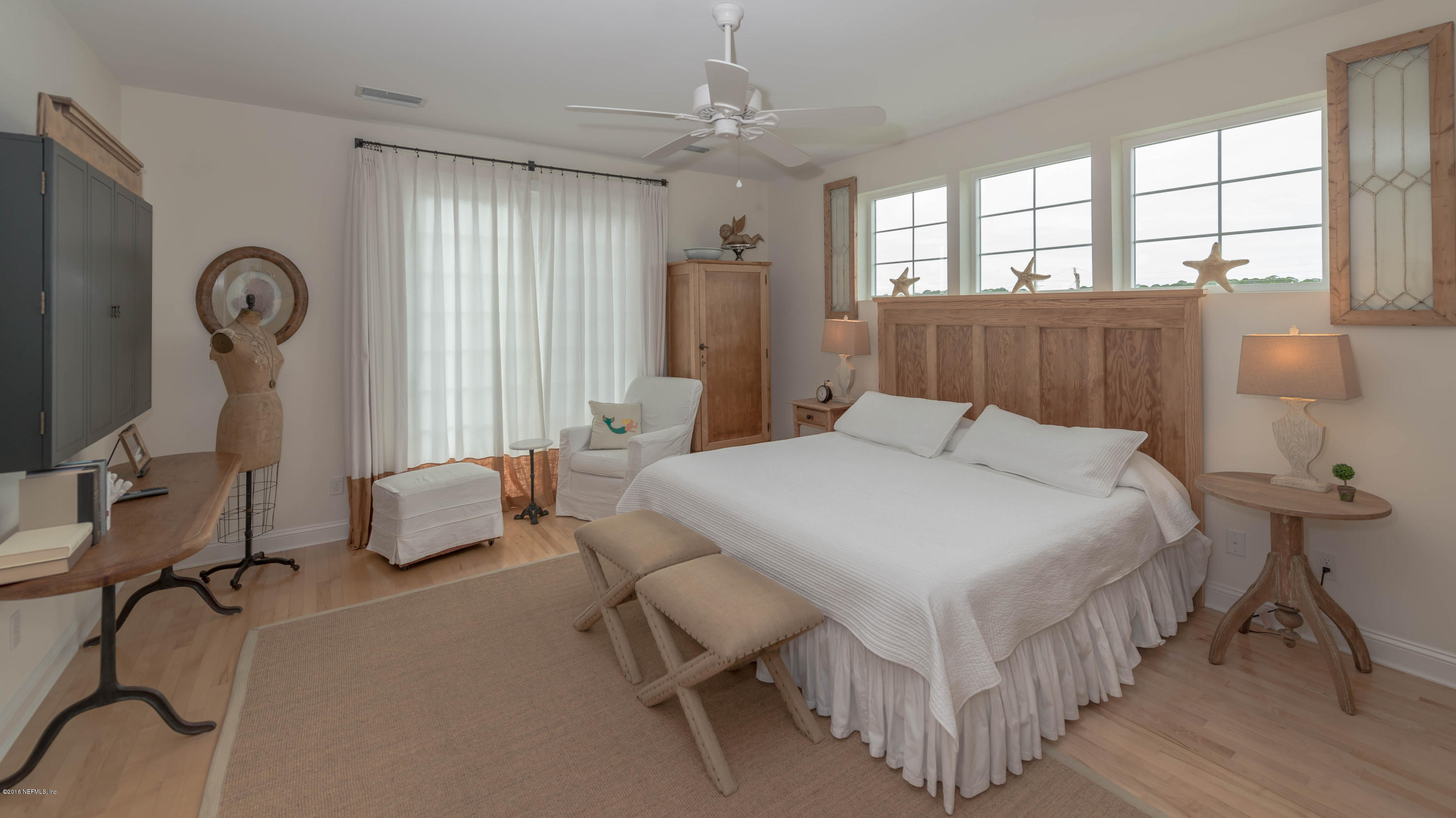 10 12th Street St. Augustine Beach, FL 32080 - Photo 22 of 45 a bedroom with bed and a large window