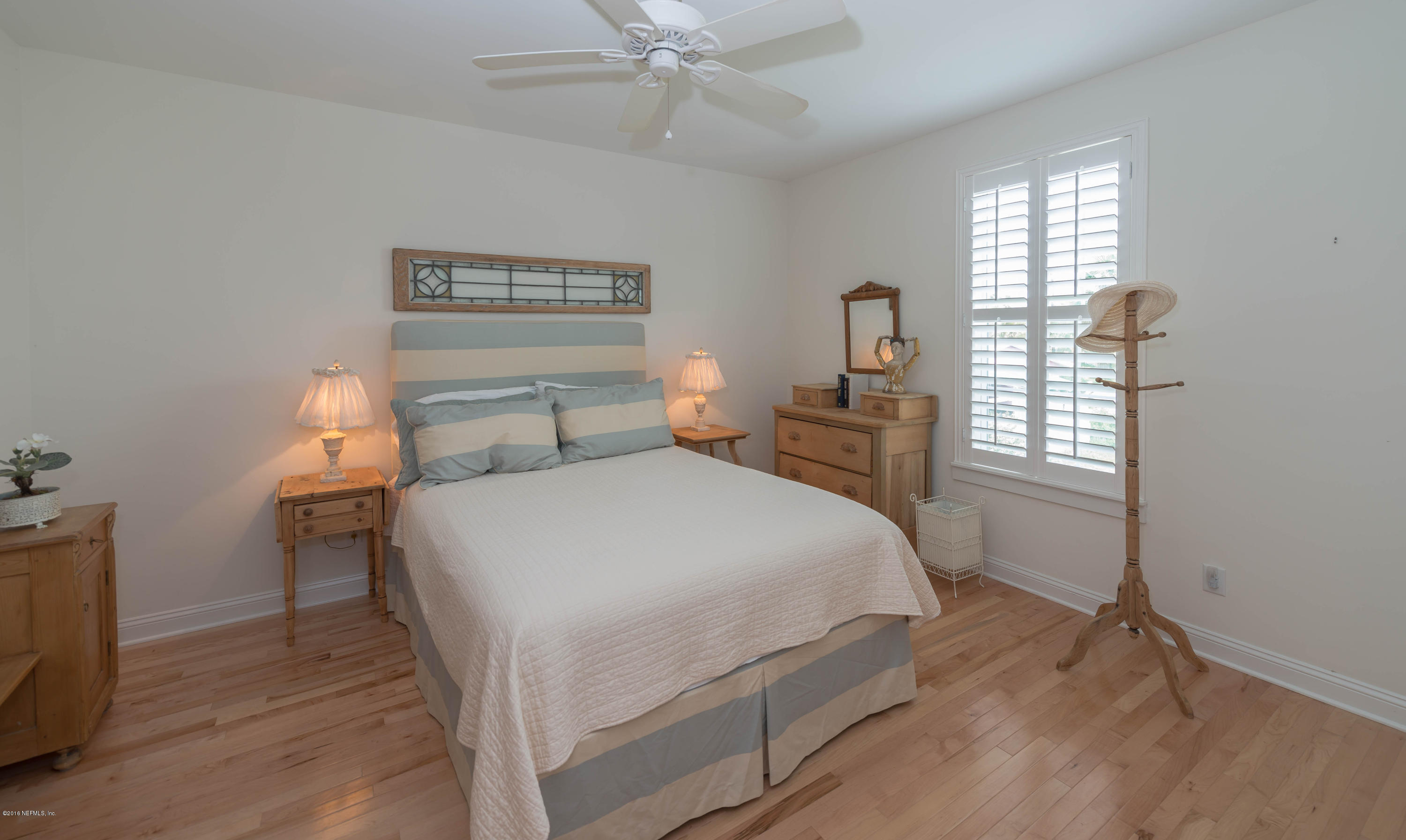 10 12th Street St. Augustine Beach, FL 32080 - Photo 37 of 45 a bedroom with a bed and a window