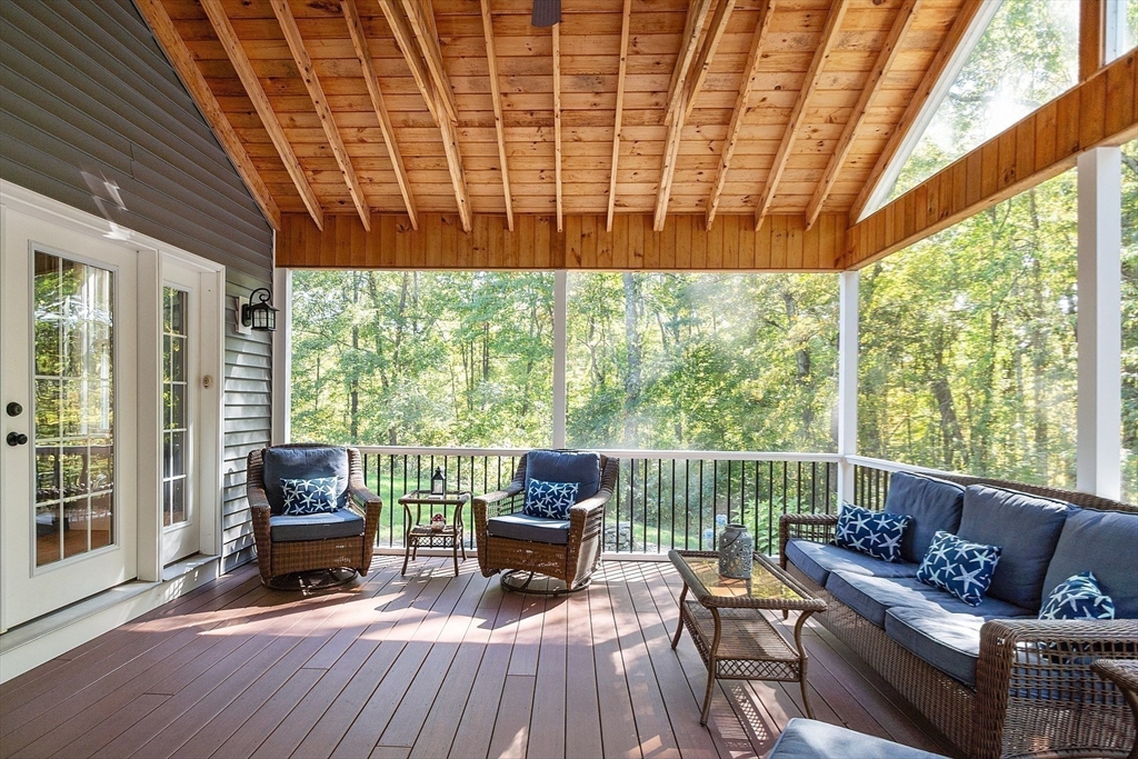 9 Winter Hill Road Lunenburg, MA 01462 - Photo 12 of 42 a living room with furniture and a floor to ceiling window