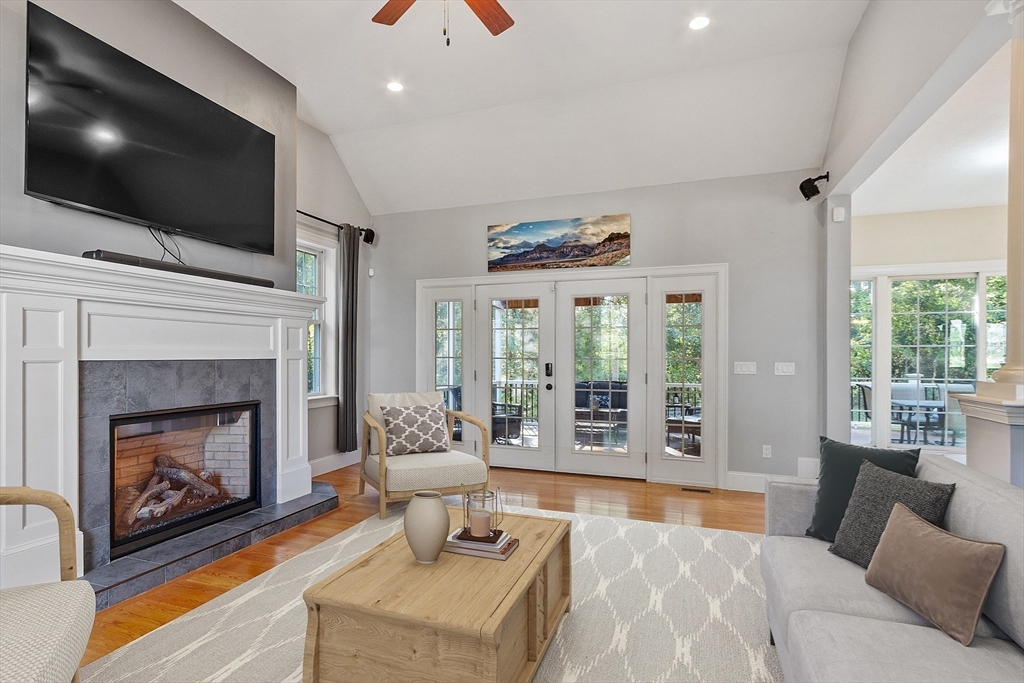 9 Winter Hill Road Lunenburg, MA 01462 - Photo 16 of 42 a living room with furniture a flat screen tv and a fireplace