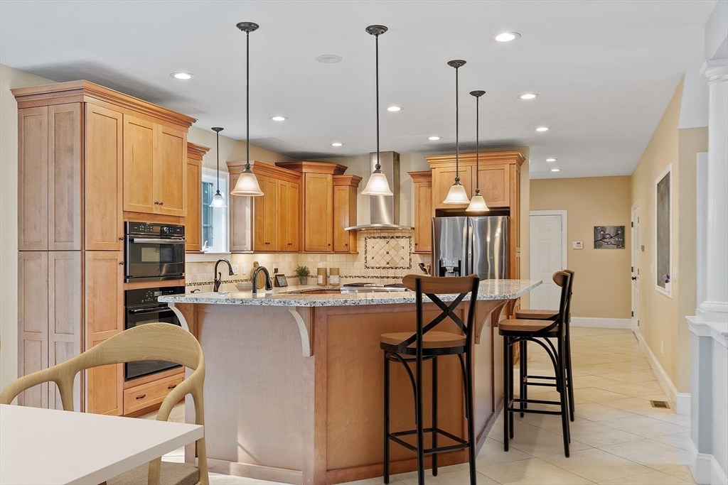 9 Winter Hill Road Lunenburg, MA 01462 - Photo 20 of 42 a kitchen with appliances cabinets and chairs