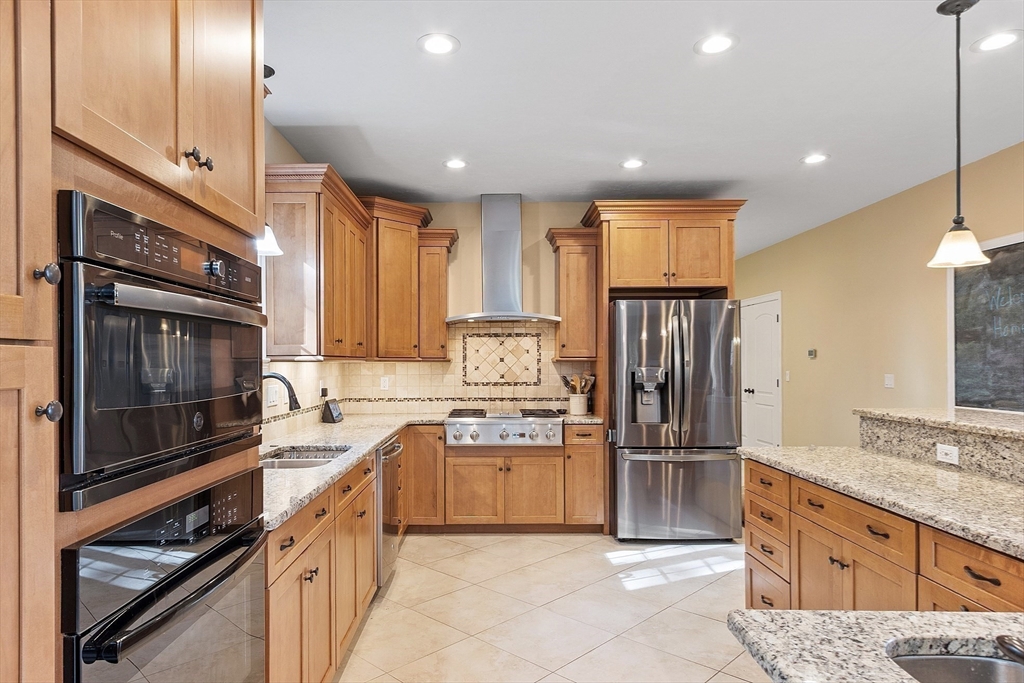 9 Winter Hill Road Lunenburg, MA 01462 - Photo 21 of 42 a kitchen with stainless steel appliances granite countertop a refrigerator stove and sink