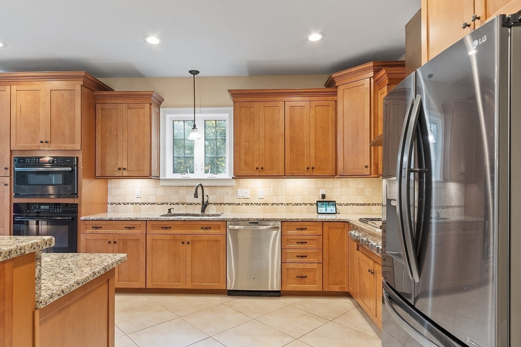 9 Winter Hill Road Lunenburg, MA 01462 - Photo 22 of 42 a kitchen with stainless steel appliances granite countertop a refrigerator sink and cabinets