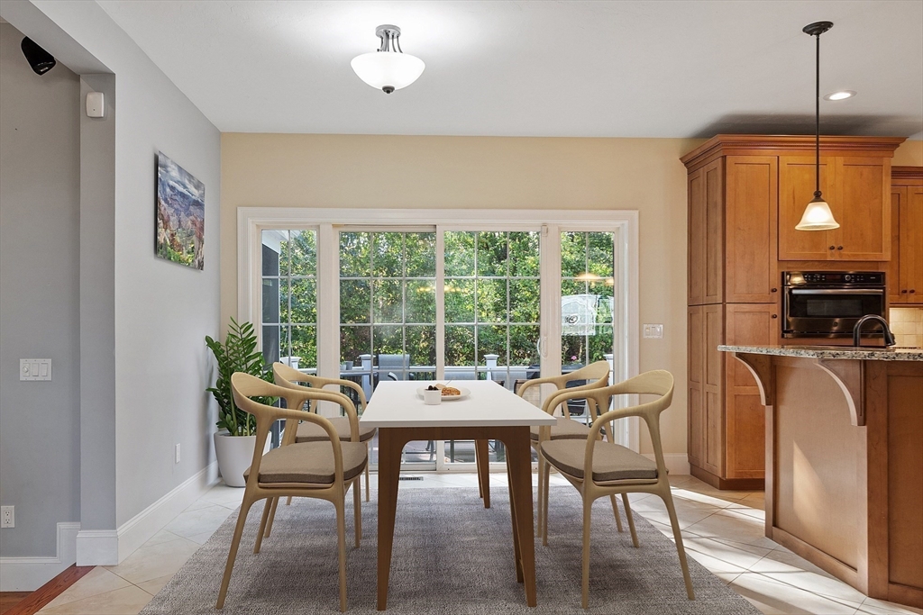 9 Winter Hill Road Lunenburg, MA 01462 - Photo 24 of 42 a dining room with furniture a chandelier and window