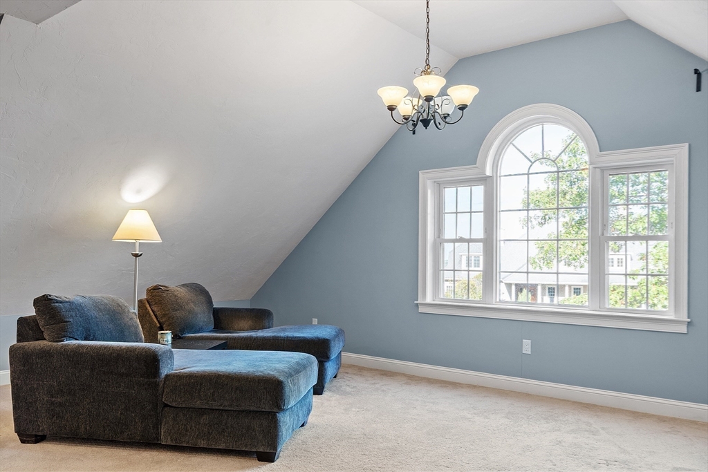 9 Winter Hill Road Lunenburg, MA 01462 - Photo 31 of 42 a living room with furniture a chandelier and a large window