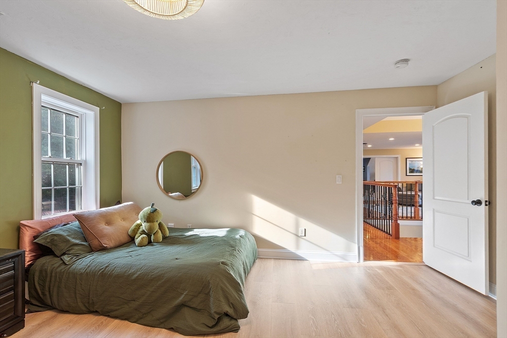 9 Winter Hill Road Lunenburg, MA 01462 - Photo 36 of 42 a bed room with a bed and a large window