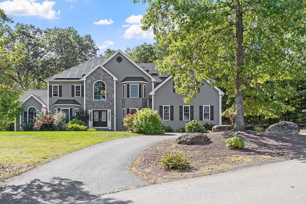 9 Winter Hill Road Lunenburg, MA 01462 - Photo 4 of 42 a front view of a house with garden and trees