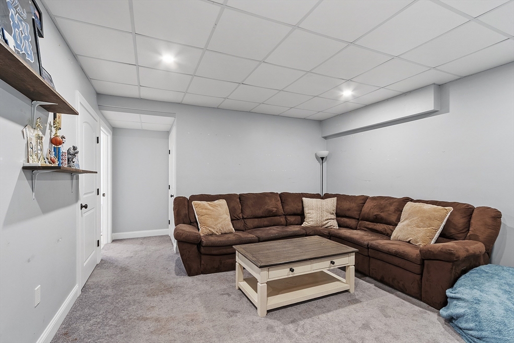 9 Winter Hill Road Lunenburg, MA 01462 - Photo 42 of 42 a living room with furniture and a couch