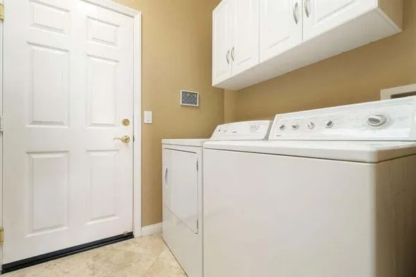 a view of a backyard with sitting area