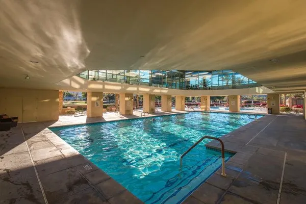a view of a swimming pool with a patio