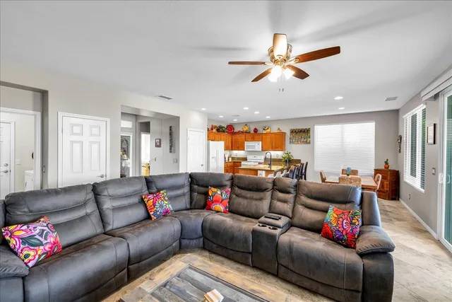 a view of a swimming pool with an outdoor space and seating area