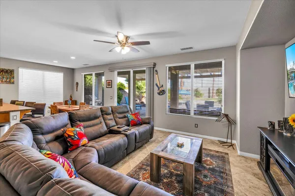 a view of a balcony with an outdoor space and a lake view