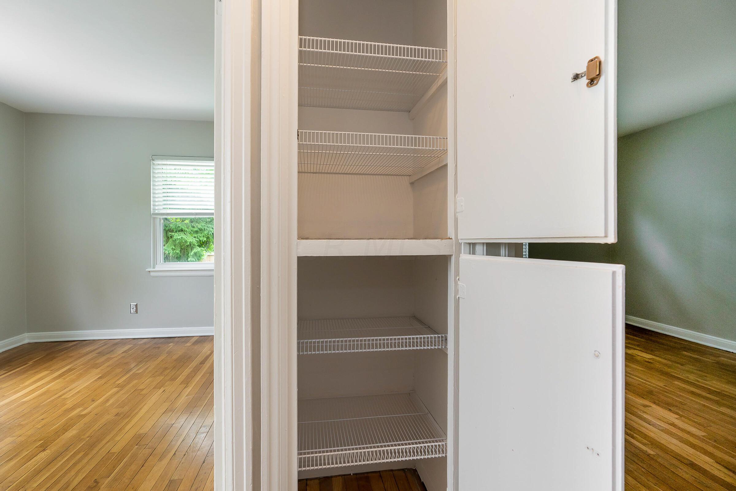 588 Northridge Road Columbus, OH 43214 - Photo 20 of 31 Built-in linen storage in the hall.