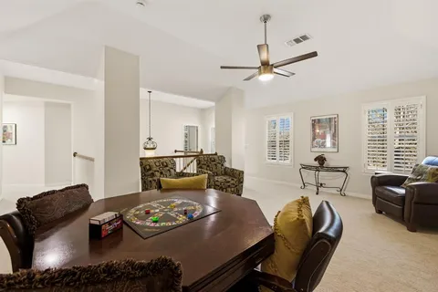 a living room with furniture and a table