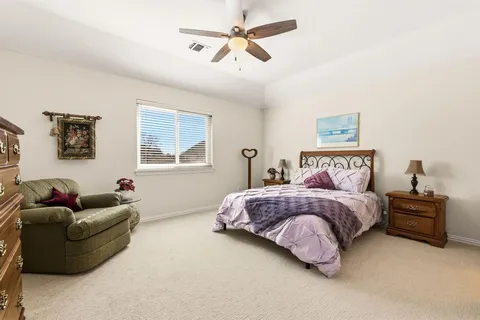 a bedroom with a bed furniture and a window