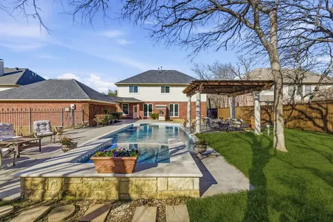 a front view of a house with swimming pool