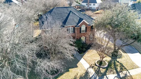 a aerial view of a house with yard