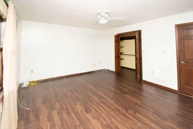 a bathroom with a toilet a sink a vanity and mirror