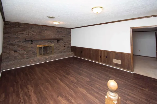 a kitchen with stainless steel appliances granite countertop a refrigerator a stove top oven a sink and dishwasher