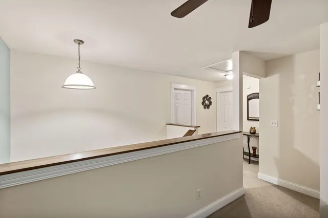 a view of a hallway with a chandelier