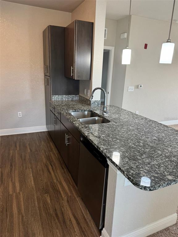 2420 Ann Rou Road, Unit 201 Tavares, FL 32778 - Photo 10 of 25 a kitchen with stainless steel appliances granite countertop a sink and a refrigerator